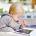Toddler Boy Playing With A Digital Tablet